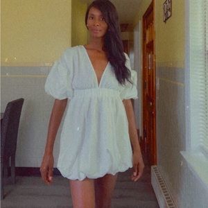 Woman’s white SHEIN dress